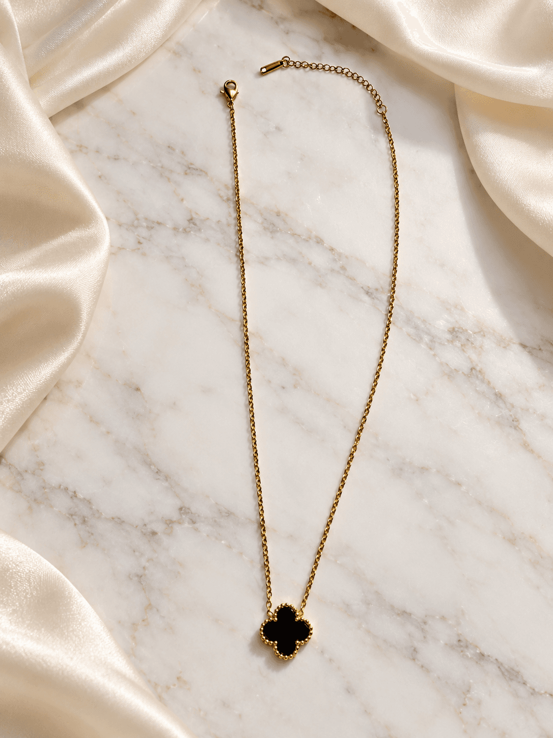 Black clover pendant necklace on ivory silk
